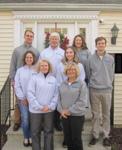 Carlinville CPA Group staff picture standing on a step in front of the office